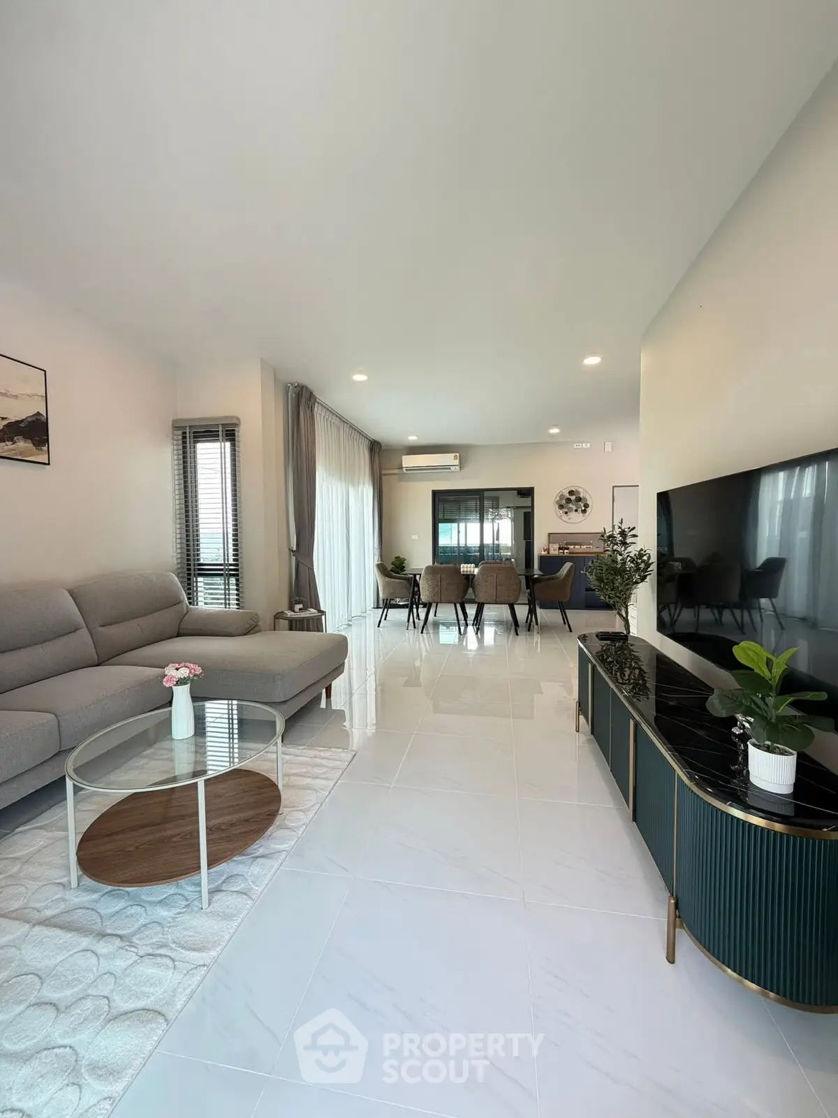 Spacious modern living room with elegant decor and large TV