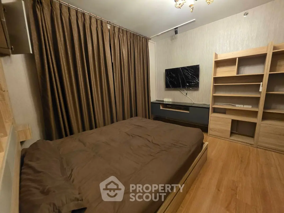 Cozy bedroom with modern furnishings and elegant brown curtains