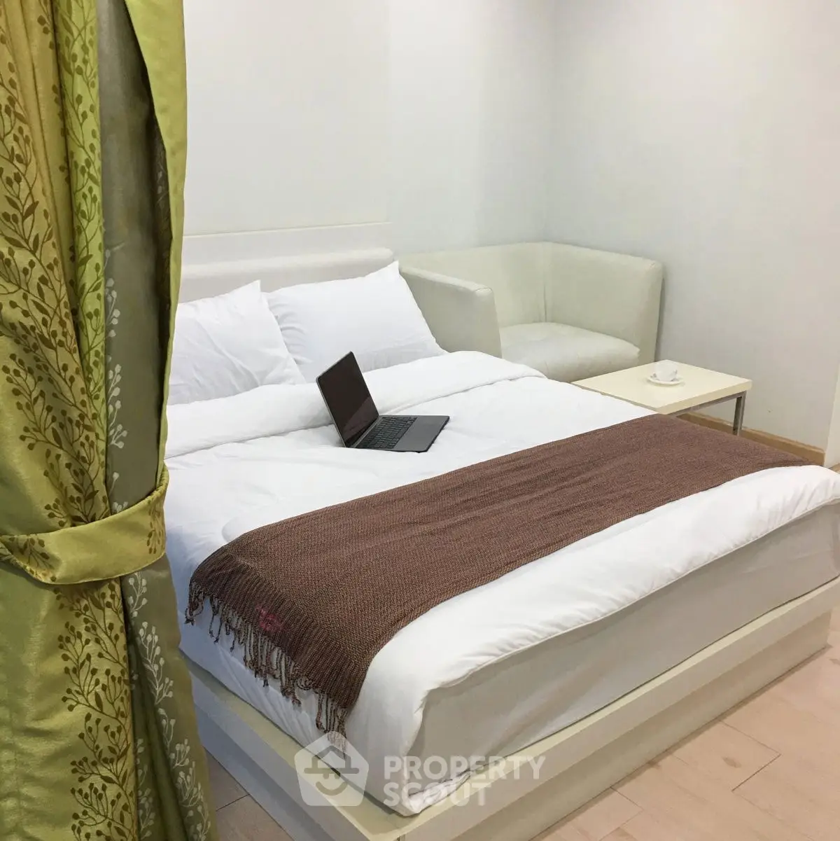 Cozy bedroom with elegant decor and a comfortable bed, perfect for relaxation.