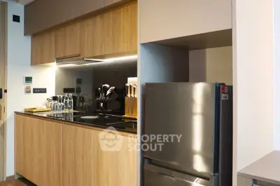 Modern kitchen with sleek wooden cabinets and stainless steel appliances