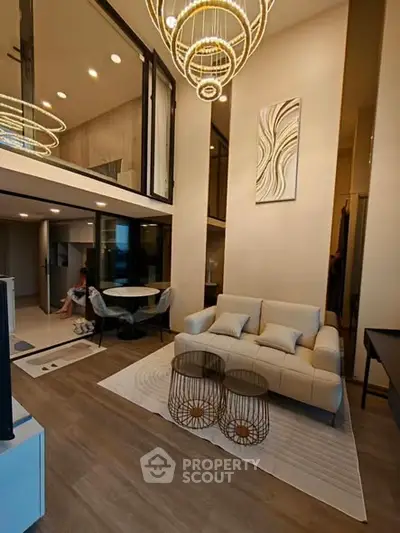 Luxurious modern living room with high ceilings and elegant lighting