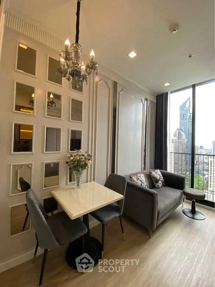 Elegant living room with city view, featuring chic decor and cozy seating area.