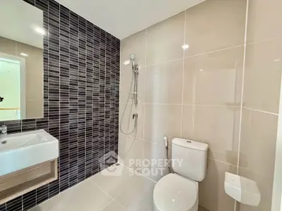 Modern bathroom with sleek tiles and contemporary fixtures
