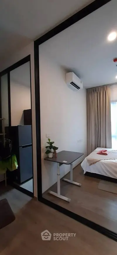 Modern bedroom with air conditioning and stylish decor in a contemporary apartment.