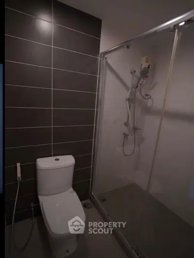 Modern bathroom with sleek shower and contemporary toilet design