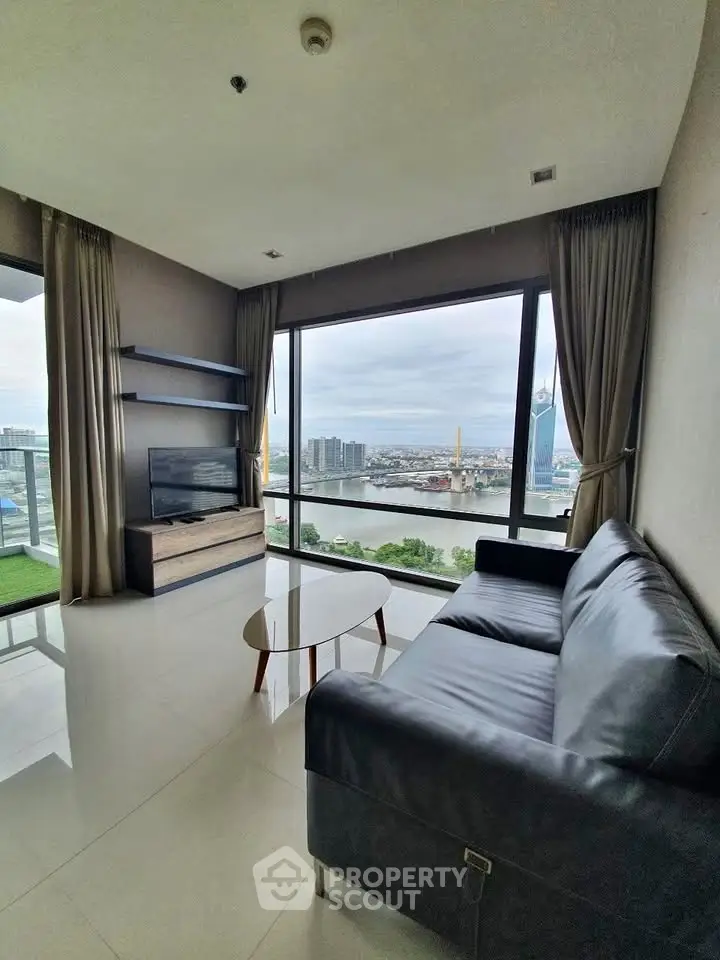 Spacious living room with stunning river view and modern furnishings