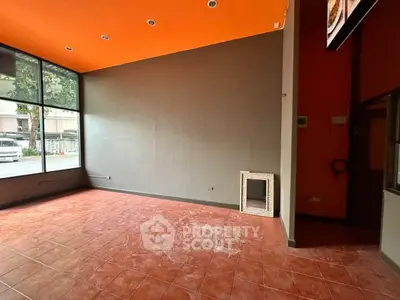 Spacious commercial space with high ceilings and large windows for lease
