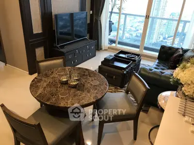 Luxurious living room with city view, elegant furniture, and marble table.