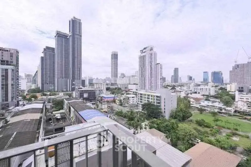 Stunning cityscape view from a high-rise balcony showcasing modern urban living.