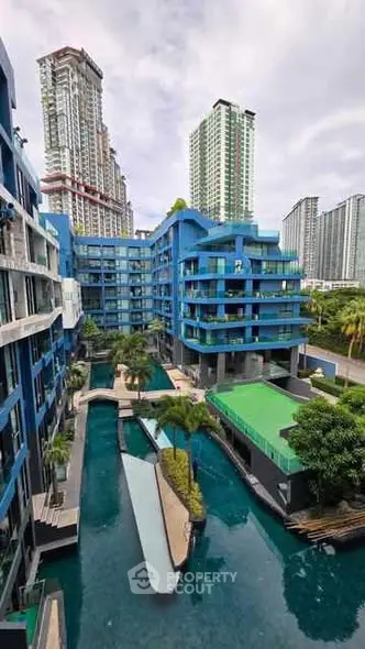 Modern urban residential complex with pool and high-rise buildings