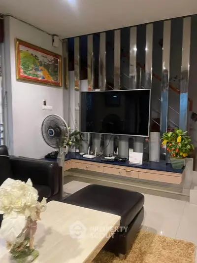 Modern living room with sleek TV setup and stylish decor