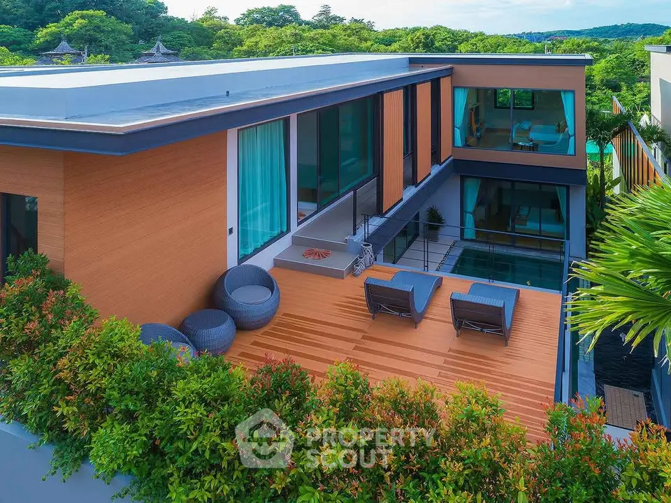 Luxurious modern villa with spacious terrace and lush greenery