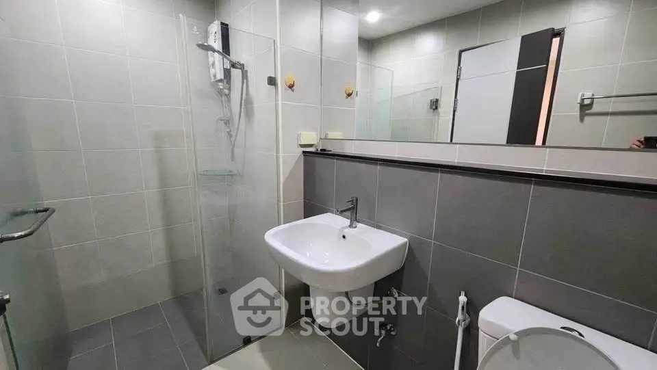 Modern bathroom with sleek design and glass shower enclosure