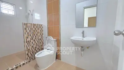 Modern bathroom with sleek fixtures and stylish tile accents