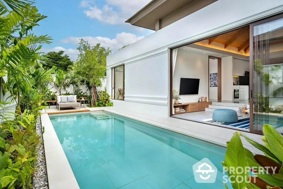 Luxurious modern villa with private pool and lush garden, perfect for serene living.