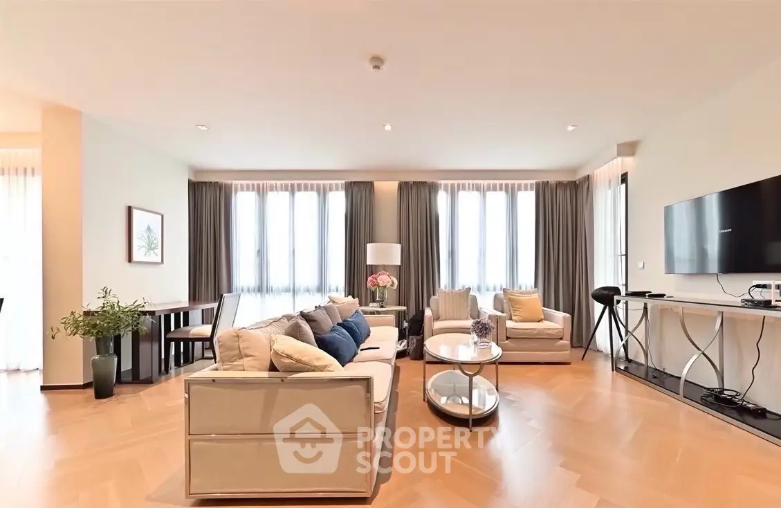 Spacious modern living room with elegant decor and large windows