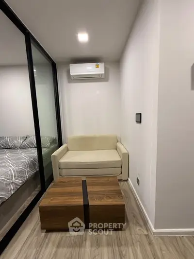 Modern compact living space with cozy seating and sleek design