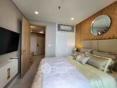 Luxurious bedroom with elegant decor and modern furnishings in a high-end apartment.