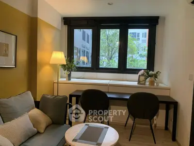 Cozy living room with modern decor and large window view