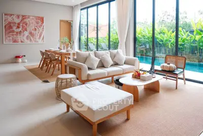 Luxurious living room with pool view and elegant decor