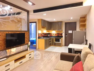 Modern open-layout living room with stylish kitchen and cozy seating area