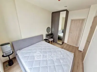 Modern bedroom with minimalist design and stylish furniture in a cozy apartment.