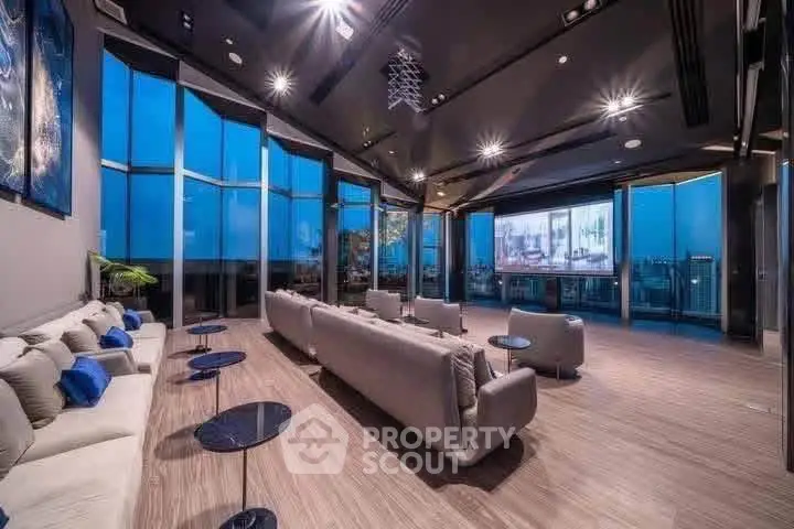 Luxurious modern living room with panoramic city views and elegant furnishings.