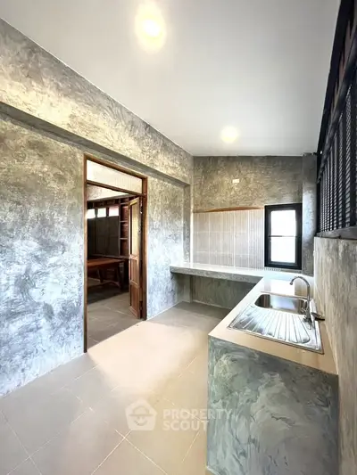 Modern kitchen with sleek design and ample natural light