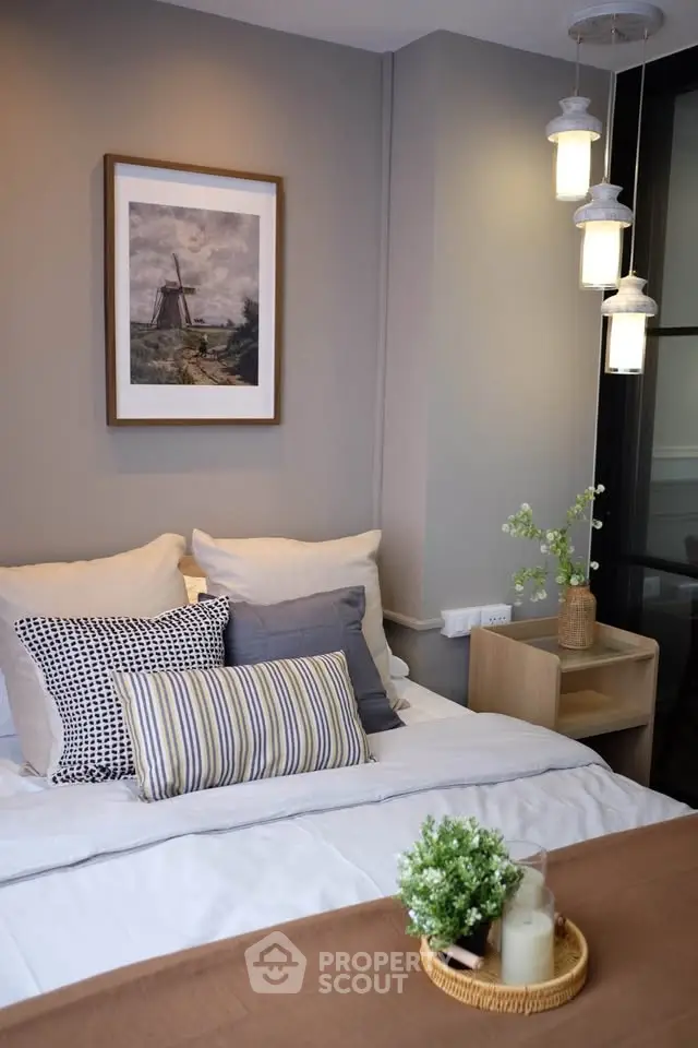 Cozy bedroom with stylish decor and modern lighting