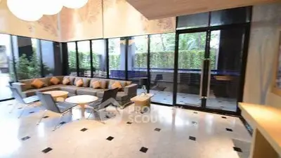 Spacious modern living room with large windows and stylish furniture.