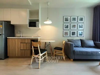 Modern living room with stylish furniture and open kitchen layout
