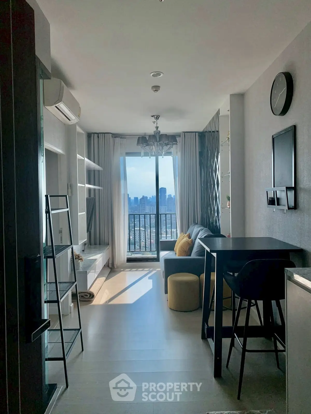 Modern living room with city view and stylish furniture