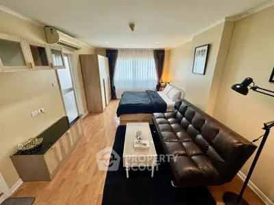 Modern studio apartment with cozy living area and stylish decor