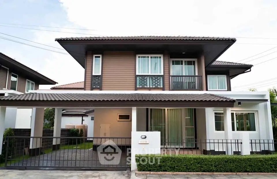 Modern two-story house with sleek design and spacious driveway in a serene neighborhood.