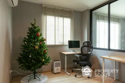 Modern home office with Christmas tree and ergonomic chair