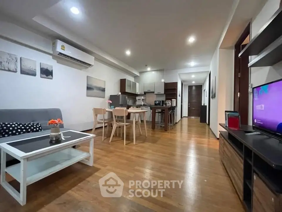 Spacious modern living room with open kitchen and stylish decor