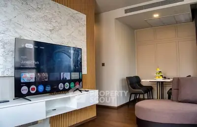 Modern living room with stylish TV setup and cozy seating area