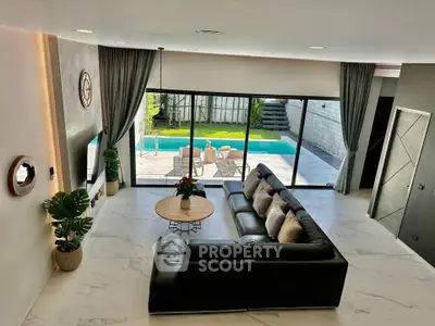 Luxurious living room with pool view and elegant decor