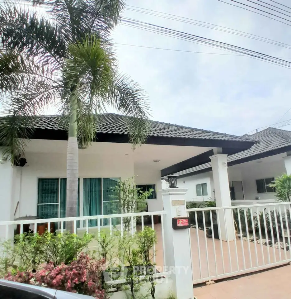 Charming single-story house with lush garden and modern design in a serene neighborhood.