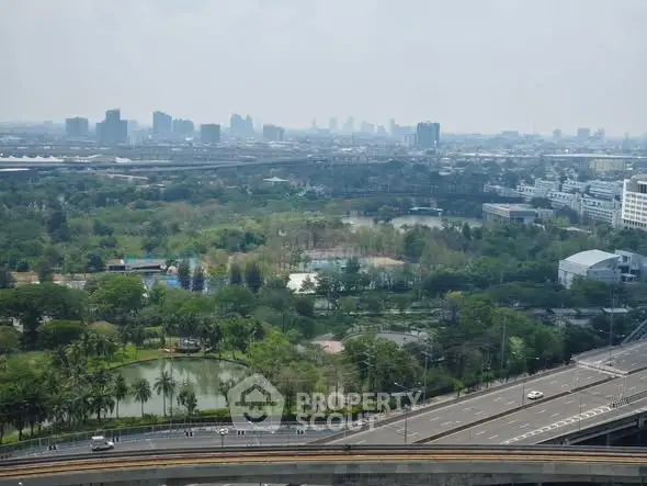 Stunning cityscape view with lush greenery and urban skyline, perfect for real estate investment.