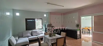 Spacious living room with modern furniture and dining area in open layout