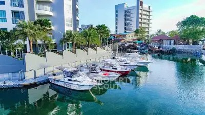 Scenic waterfront property with modern architecture and docked boats, offering serene views and luxury living.