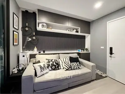 Modern living room with stylish decor and cozy sofa in a contemporary apartment.