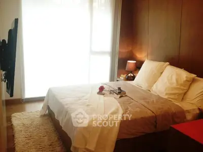 Cozy and elegant bedroom with warm lighting and modern decor, perfect for relaxation.