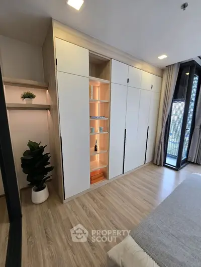 Modern bedroom with built-in wardrobe and stylish decor