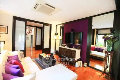 Luxurious living room with modern decor and vibrant accents