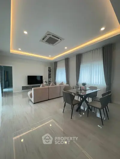 Spacious modern living room with elegant dining area and stylish lighting