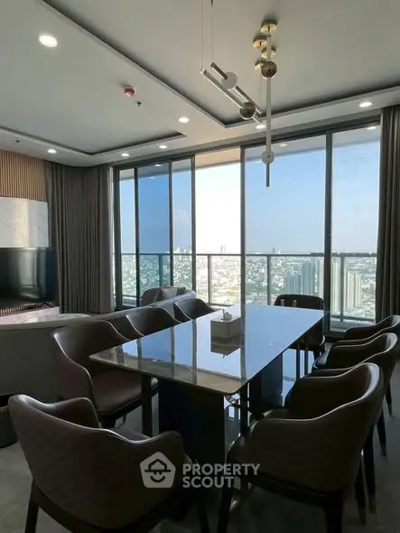 Luxurious dining area with stunning city view in modern high-rise apartment