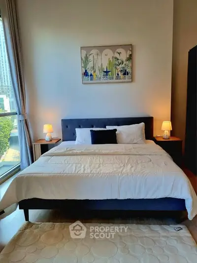 Luxurious bedroom with modern decor and large window view