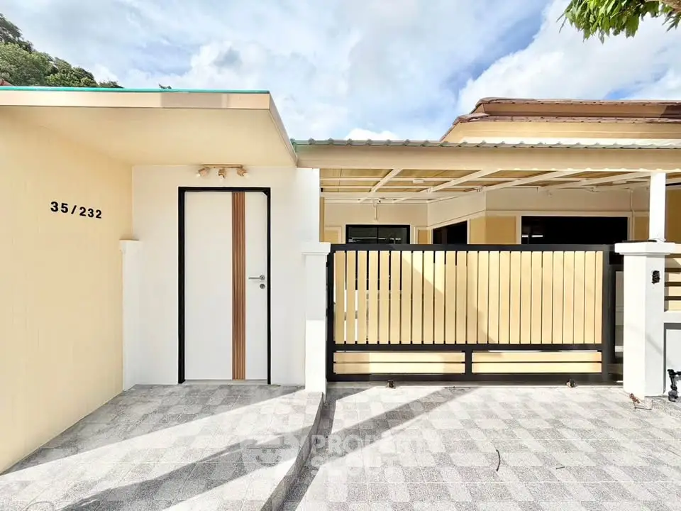 Modern single-story home with gated entrance and sleek design